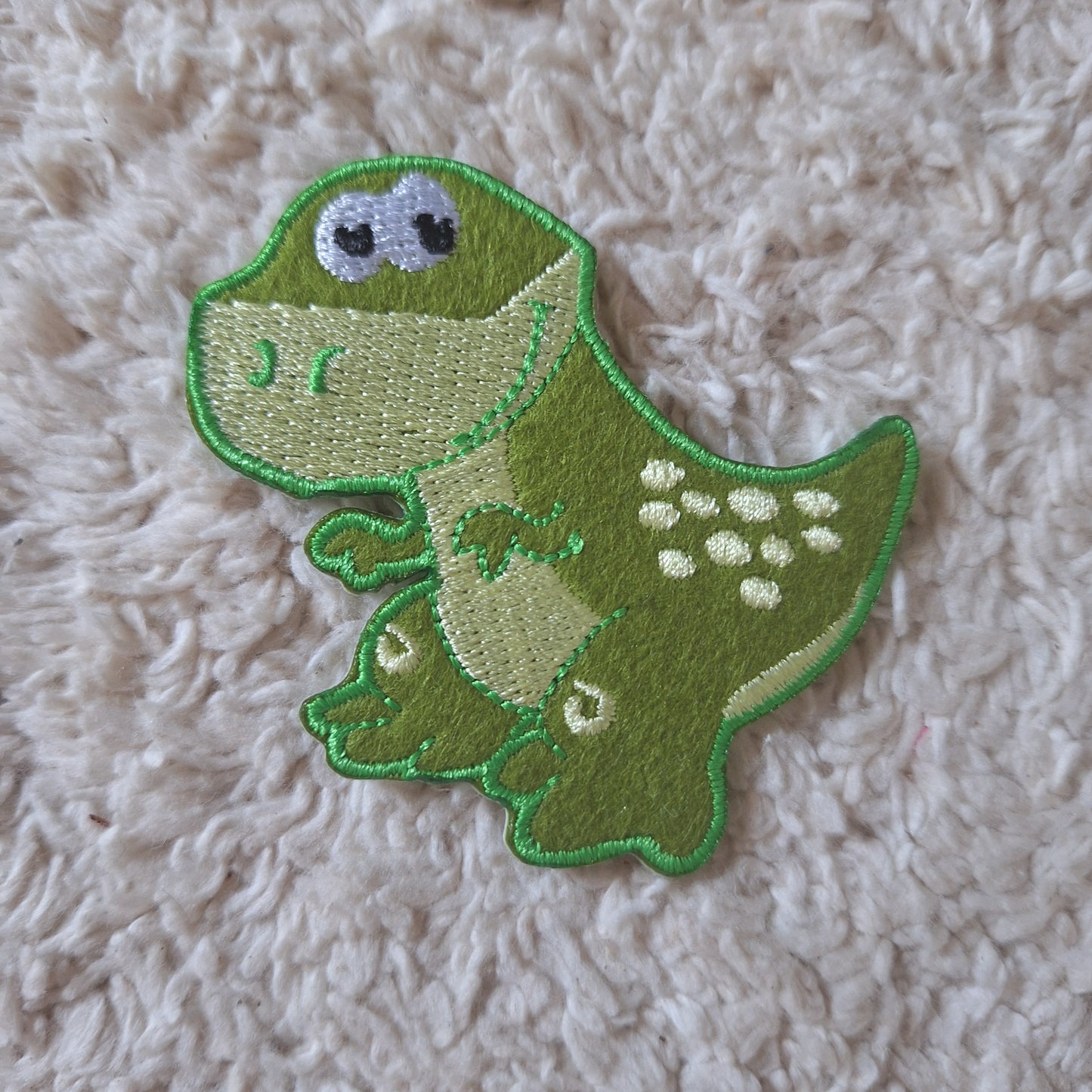 Dino embleem